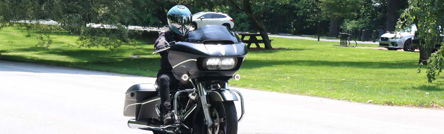 Biker on harley davidson motorcycle with engine history